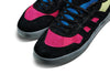 A pair of black and pink ADIDAS GONZ ALOHA SUPER "EIGHTIES" SHOCK PINK / CORE BLACK / FROZEN YELLOW sneakers on a white background.