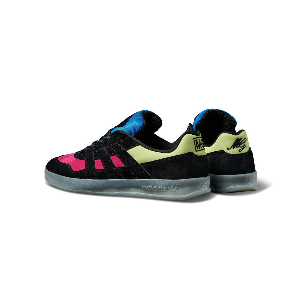 A pair of black and pink ADIDAS GONZ ALOHA SUPER "EIGHTIES" SHOCK PINK / CORE BLACK / FROZEN YELLOW sneakers on a white background.
