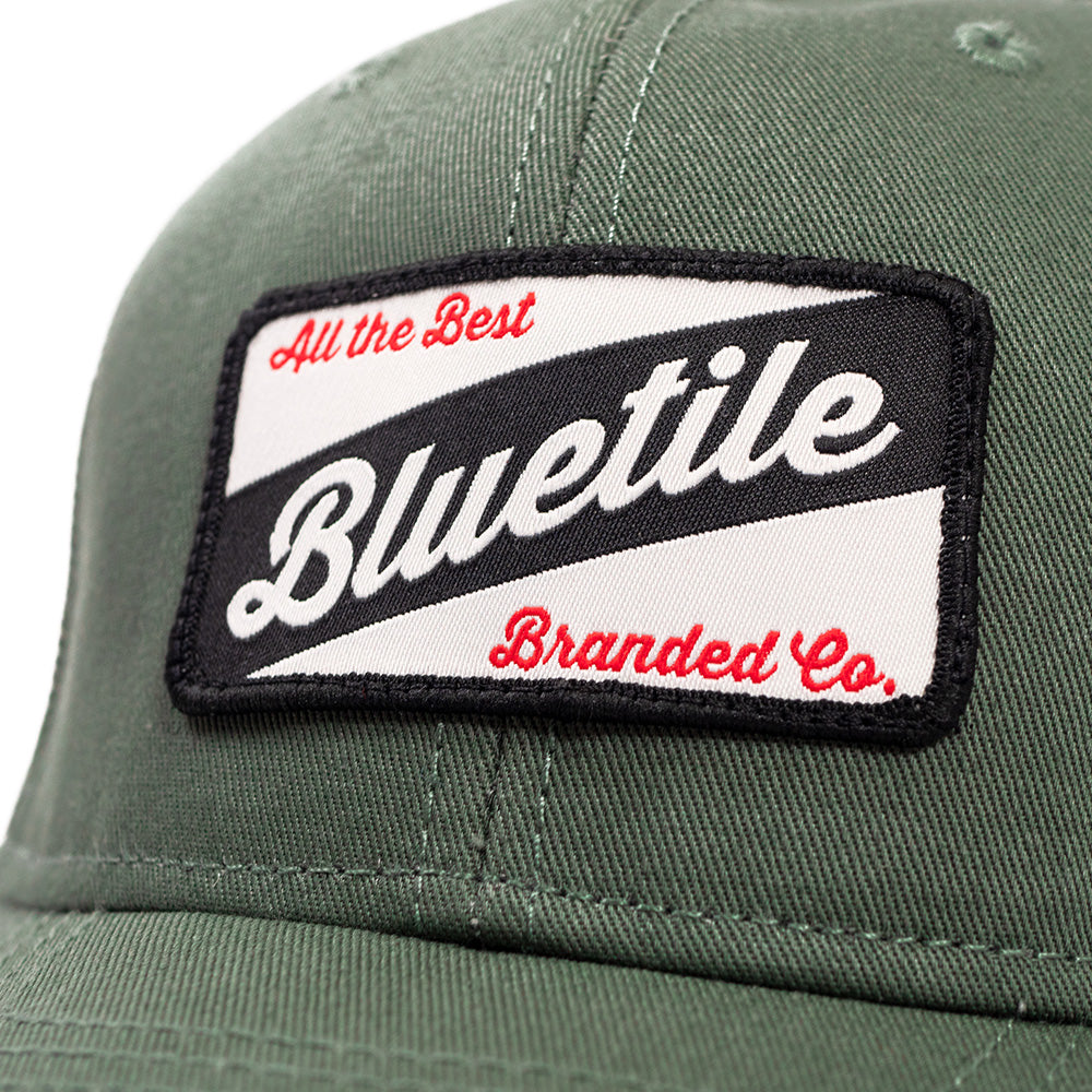 A BLUETILE CRAFT PATCH TRUCKER CYPRESS hat that proudly displays the logo of Bluetile Skateboards, the best in craft patch products.