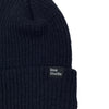 A navy Bluetile Love Always Knit Beanie with a tag on it.