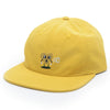 A BLUETILE yellow hat with a monkey embroidered on it.