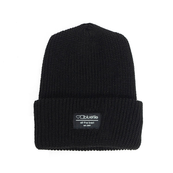 A BLUETILE SURPLUS BEANIE BLACK with a label on it.