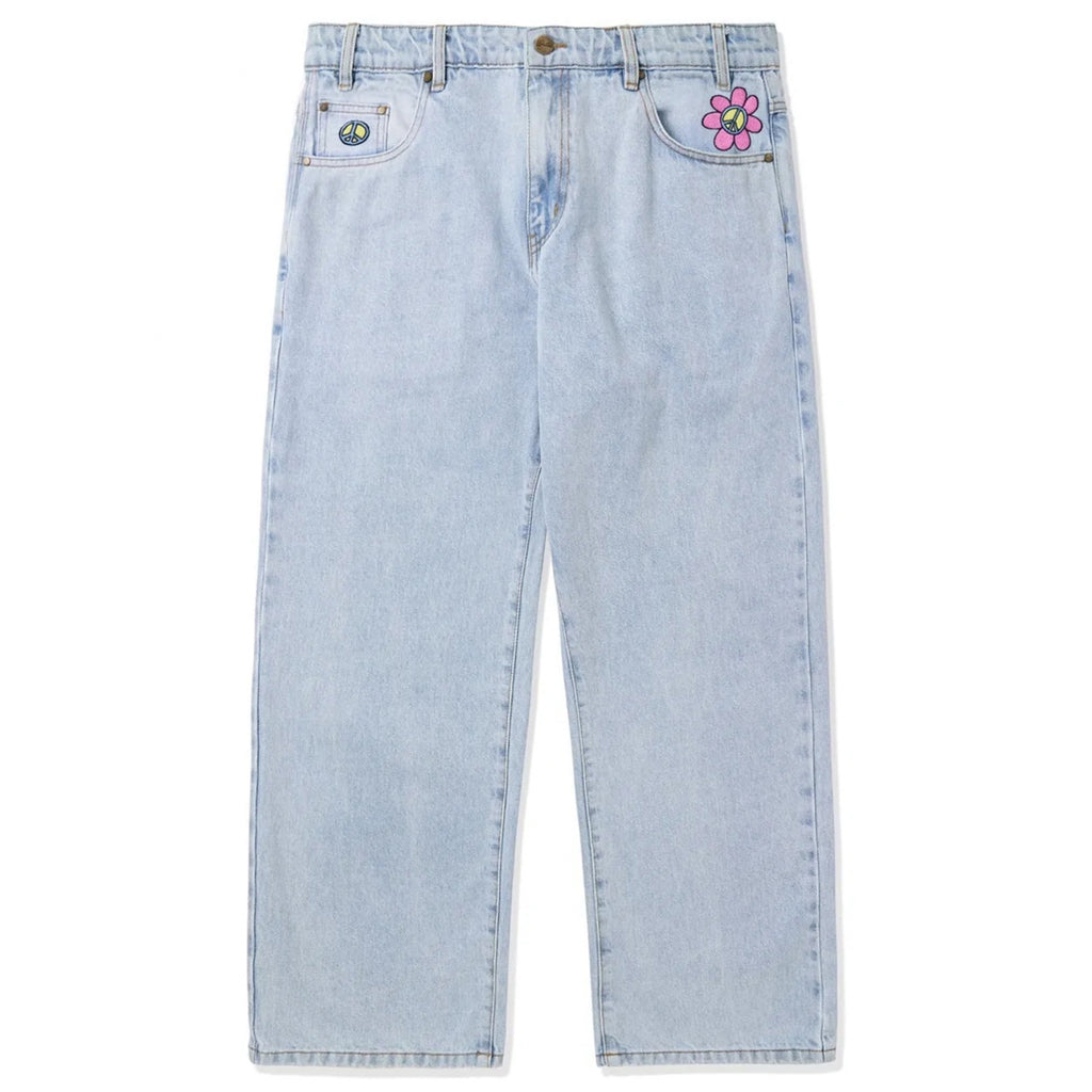 A pair of Butter Goods Flower Denim Jeans in light blue.