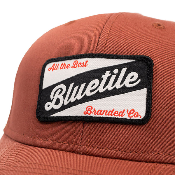 A BLUETILE CRAFT PATCH TRUCKER CLAY hat by Bluetile Skateboards.