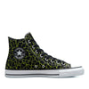 A pair of skate shoes with green and black giraffe print.