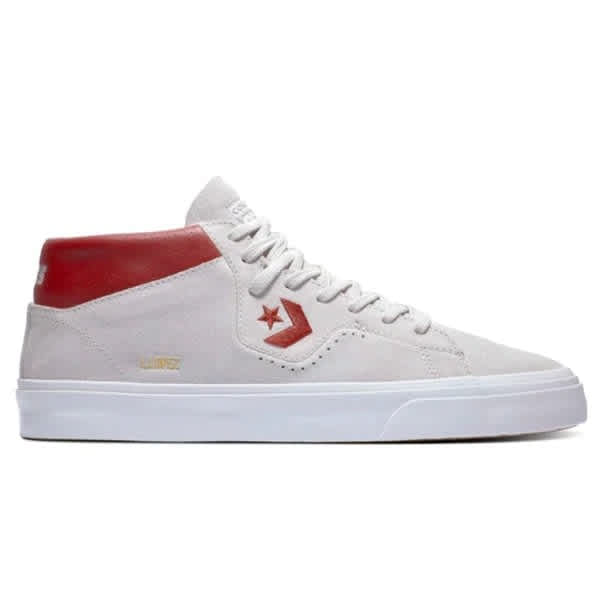 a mid style white and ivory shoe with red accents and the converse logo on the side