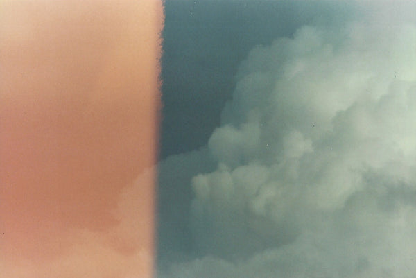 A photo print of Cloudy Bleach by Chris Cryer and Bluetile Skateboards.