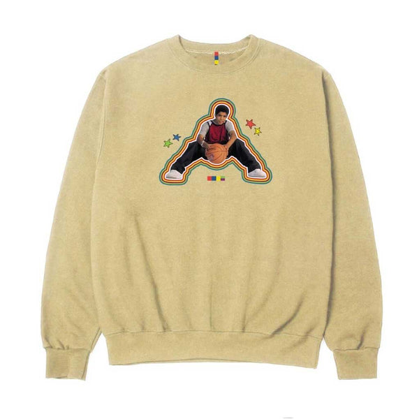 The COLOR BARS DEGRASSI BALLER CREWNECK SANDSTONE by COLOR BARS features a beige crewneck design with a graphic of a person in a dancing pose, surrounded by colorful stars, giving off major baller vibes.