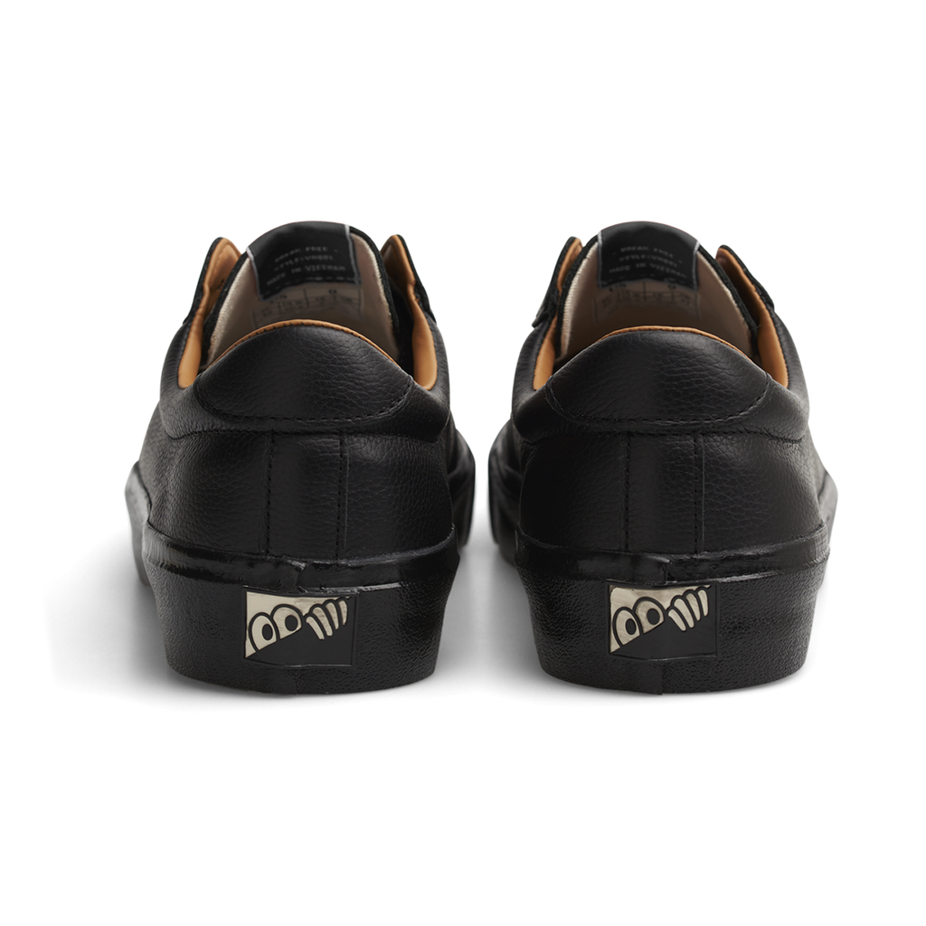 A pair of LAST RESORT AB black leather sneakers with a logo on the side, made of VM001 Mill Leather.