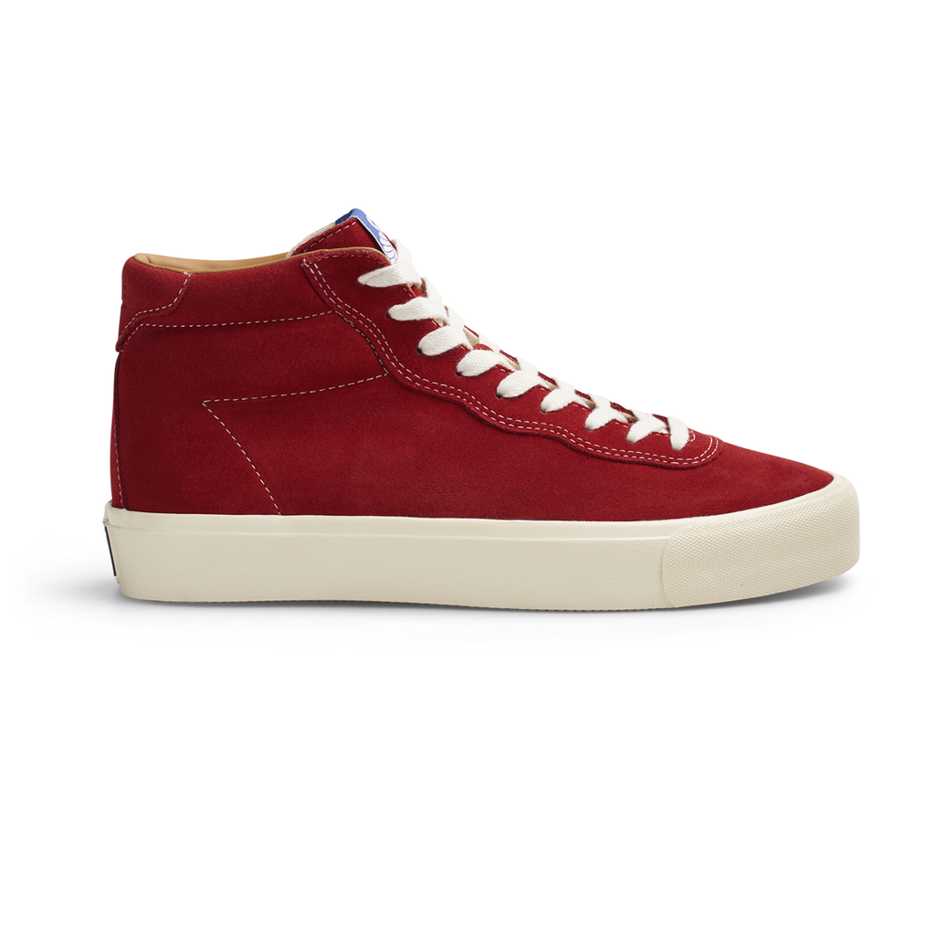 A Last Resort AB red high top sneaker with white laces, made of hi suede material.