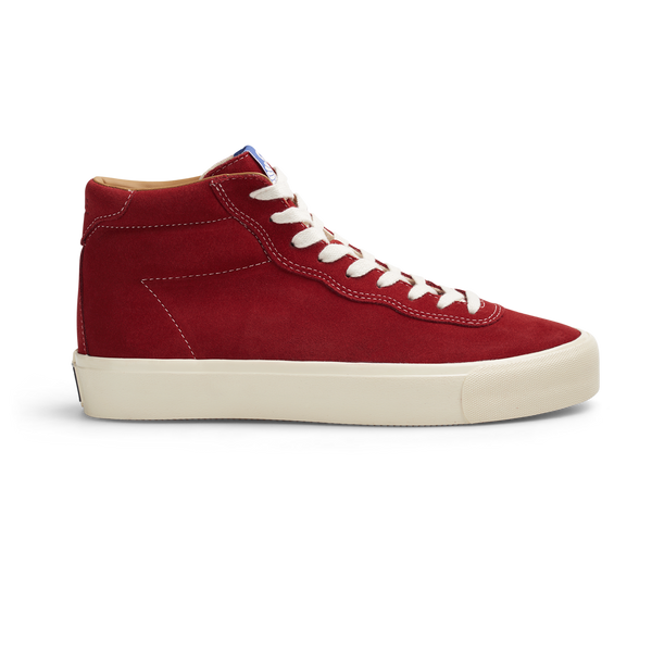 A Last Resort AB red high top sneaker with white laces, made of hi suede material.
