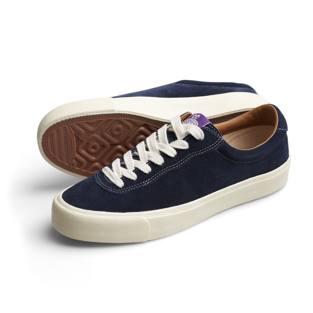 The LAST RESORT AB VM001 men's navy sued sneaker with a white sole.
