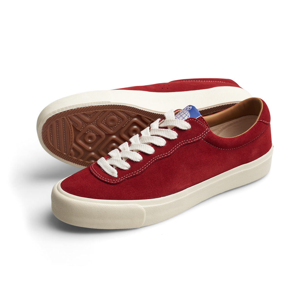 The LAST RESORT AB VM001 OLD RED/WHITE is an old red suede sneaker featuring white laces.