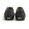 A pair of Last Resort AB VM003 Suede Lo Steel Grey / Black shoes with green soles.