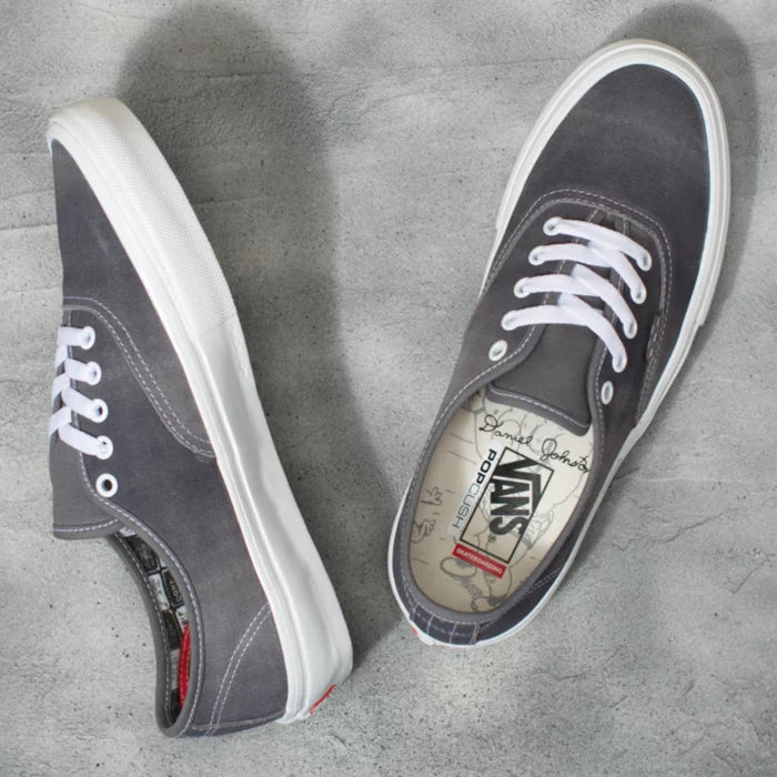 An authentic pair of grey Vans SKATE AUTHENTIC DANIEL JOHNSTON RAVEN sneakers perfect for skateboarding, featuring white laces.