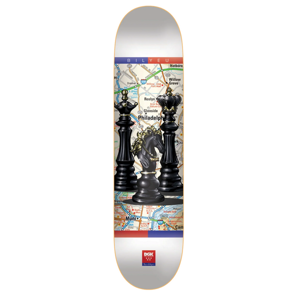 A DGK skateboard with a picture of chess on it.