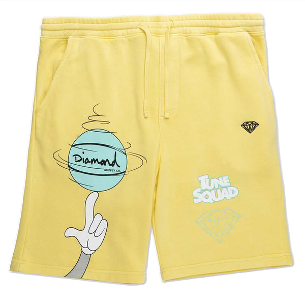 a yellow pair of shorts with a basketball and diamond image