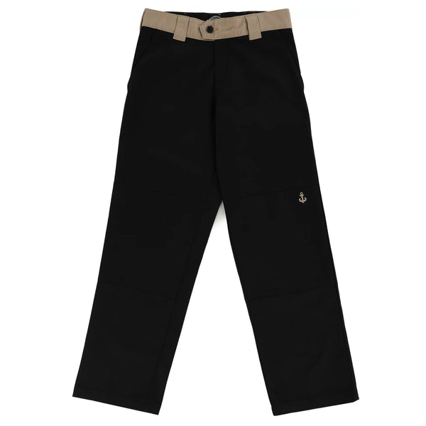 A pair of DICKIES RONNIE SANDOVAL DOUBLE KNEE PANT BLACK / DESRT SAND pants with a brown belt.