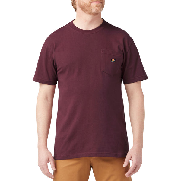 A man wearing a grape wine DICKIES SKATEBOARDING HEAVYWEIGHT POCKET TEE and tan pants.