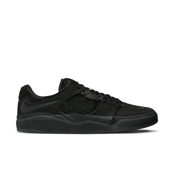 The NIKE SB ISHOD PRM BLACK / BLACK by Nike is a black low-top skate sneaker with textured side panels, black laces, and a solid black sole, shown in side view against a white background.