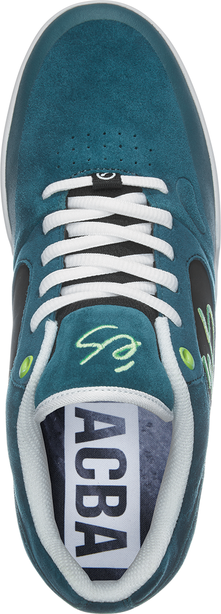 An ES Swift skate shoe in black with the word ACBA on it. (Replace with) An ES SWIFT 1.5 MACBA TEAL / BLACK skate shoe with the word ACBA on it.