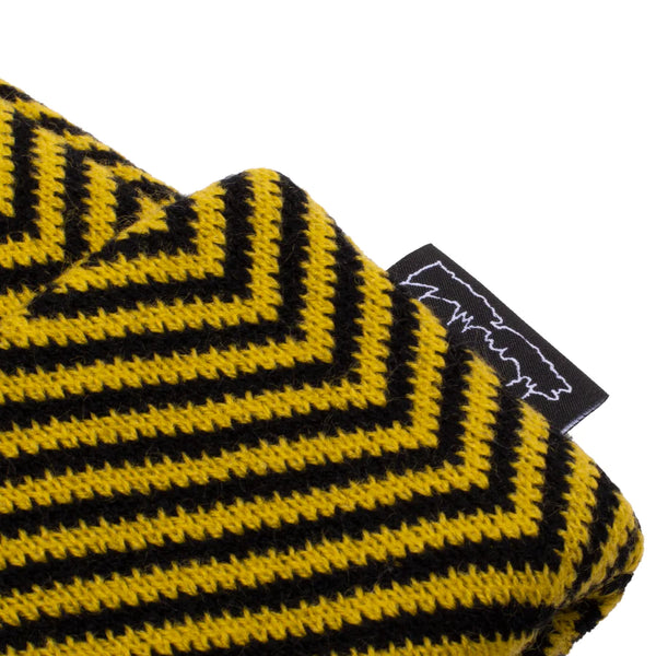 A close up of a yellow and black FUCKING AWESOME HURT YOUR EYES BEANIE MUSTARD scarf.