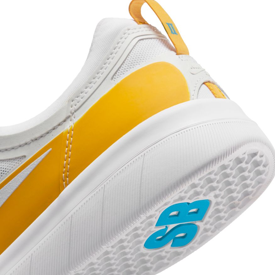 A white and yellow nike SB NYJAH FREE II DARK SULFUR/WHITE-LASER BLUE sneaker with yellow accents.