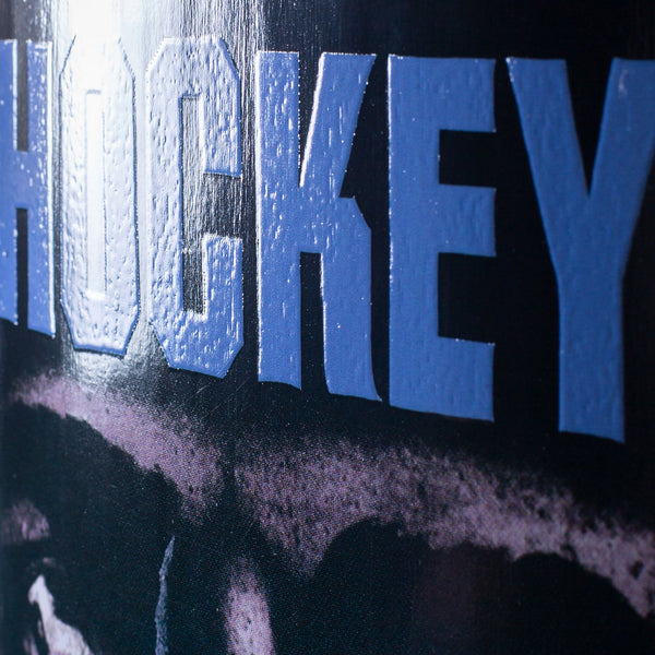 Close-up of the HOCKEY ALLEN HP SYNTHETIC skateboard surface, showing bold blue "HOCKEY" lettering on a dark background. Size: 8.5" x 31.91"; Brand: HOCKEY.