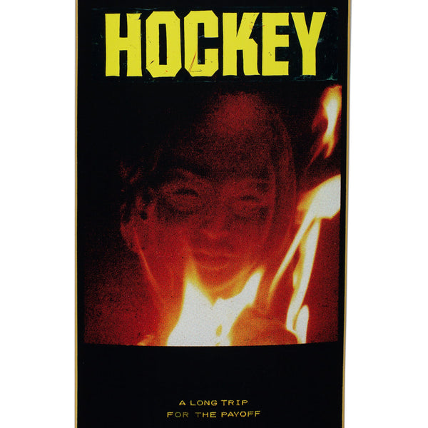 A skateboard with a face and fire image.
