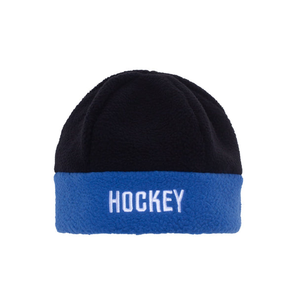 A Hockey Shepherd Beanie Black/Blue with the word Hockey on it.