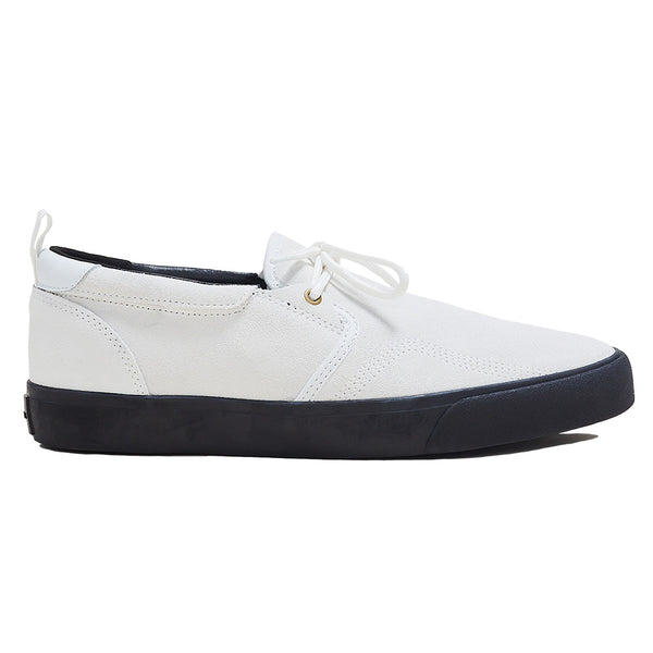 A white dress style shoe with a black sole