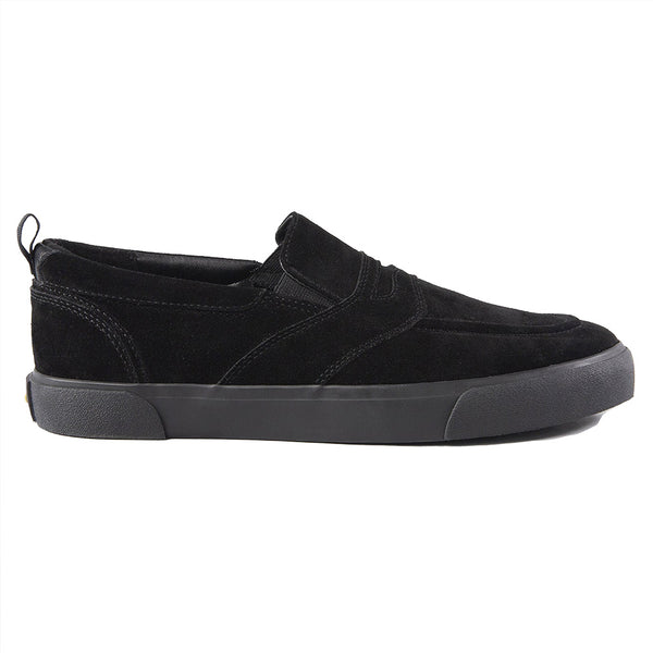 A black HOURS IS YOURS slip-on shoe with a suede upper and a black sole.