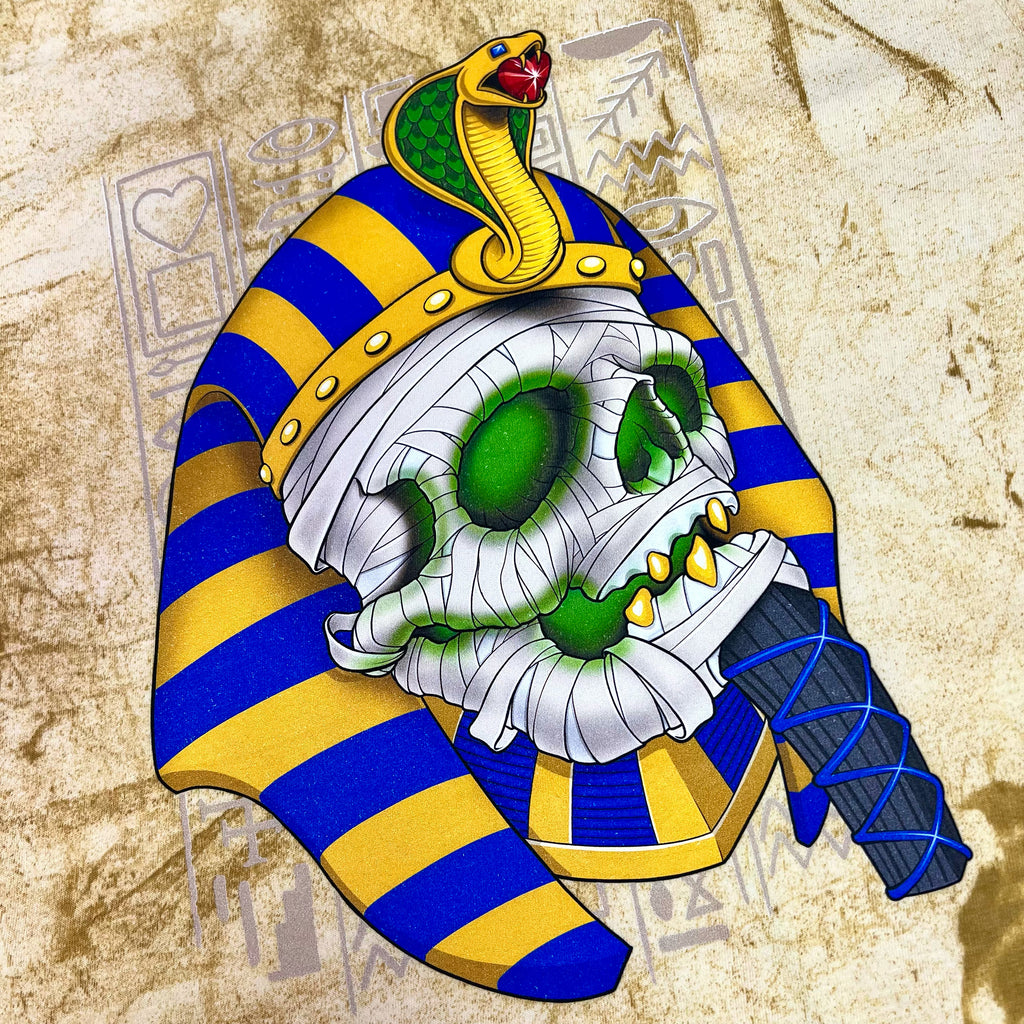 An Egyptian skull with a unique color blast, captivating BLUETILE PHARAOH MUMMY PAPYRUS tones, and a snake in his mouth.