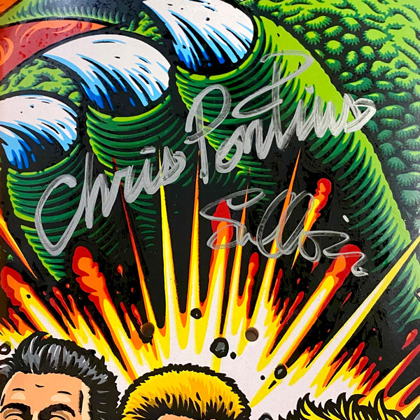 Close-up of a vibrant artwork from STRANGELOVE's collection, specifically the STRANGE LOVE CHRIS PONTIUS *SIGNED board, featuring a large green claw and a bright explosive design. The image is enhanced with two autographs in white markers, reminiscent of the energetic aesthetics characteristic of Sean Cliver's designs.