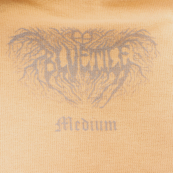 The back of a sweatshirt with the word 'BLUETILE METAL OVERSIZED TEE SAND' written on it in custom-milled fabric, by Bluetile Skateboards.