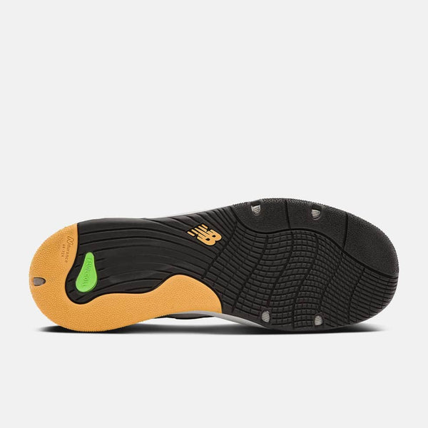 The back of a black and yellow NB NUMERIC 1010 TIAGO LEMOS GREY / BLACK shoe on a white background featuring NB Numeric footwear.
