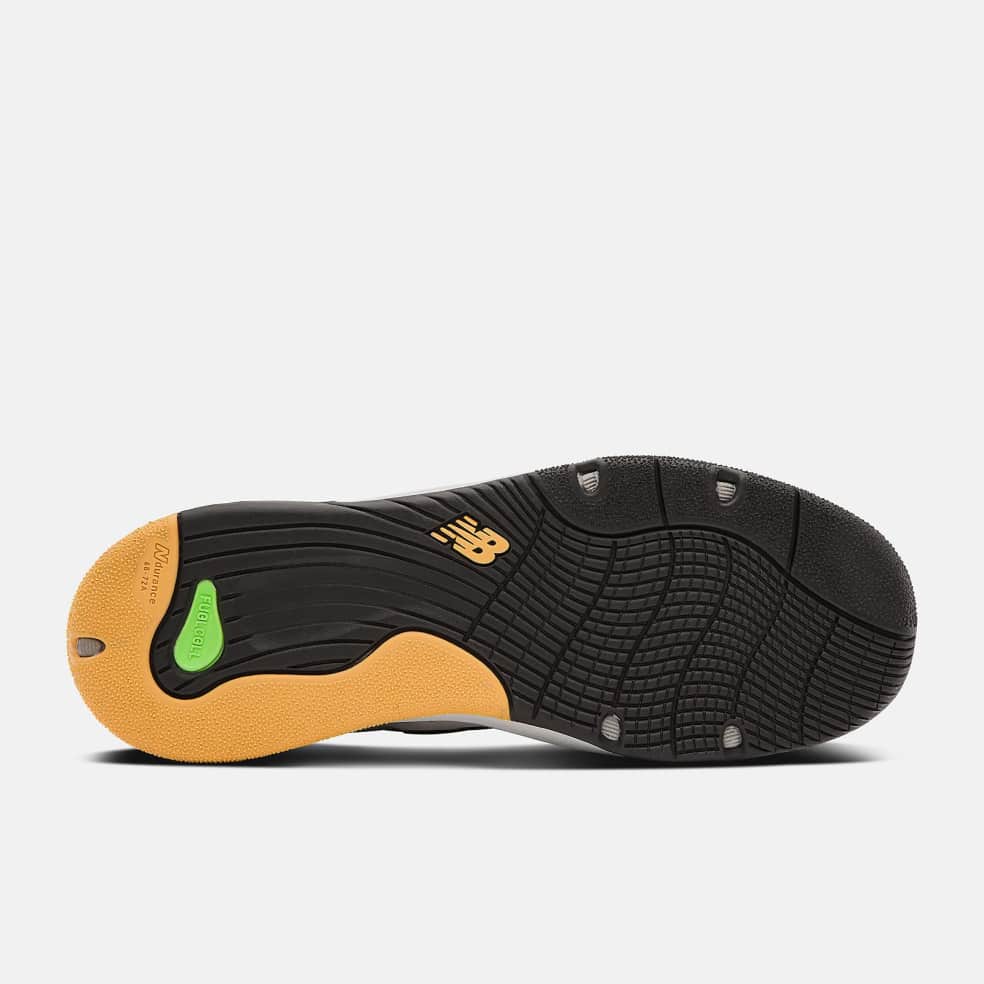 The back of a black and yellow NB NUMERIC 1010 TIAGO LEMOS GREY / BLACK shoe on a white background featuring NB Numeric footwear.