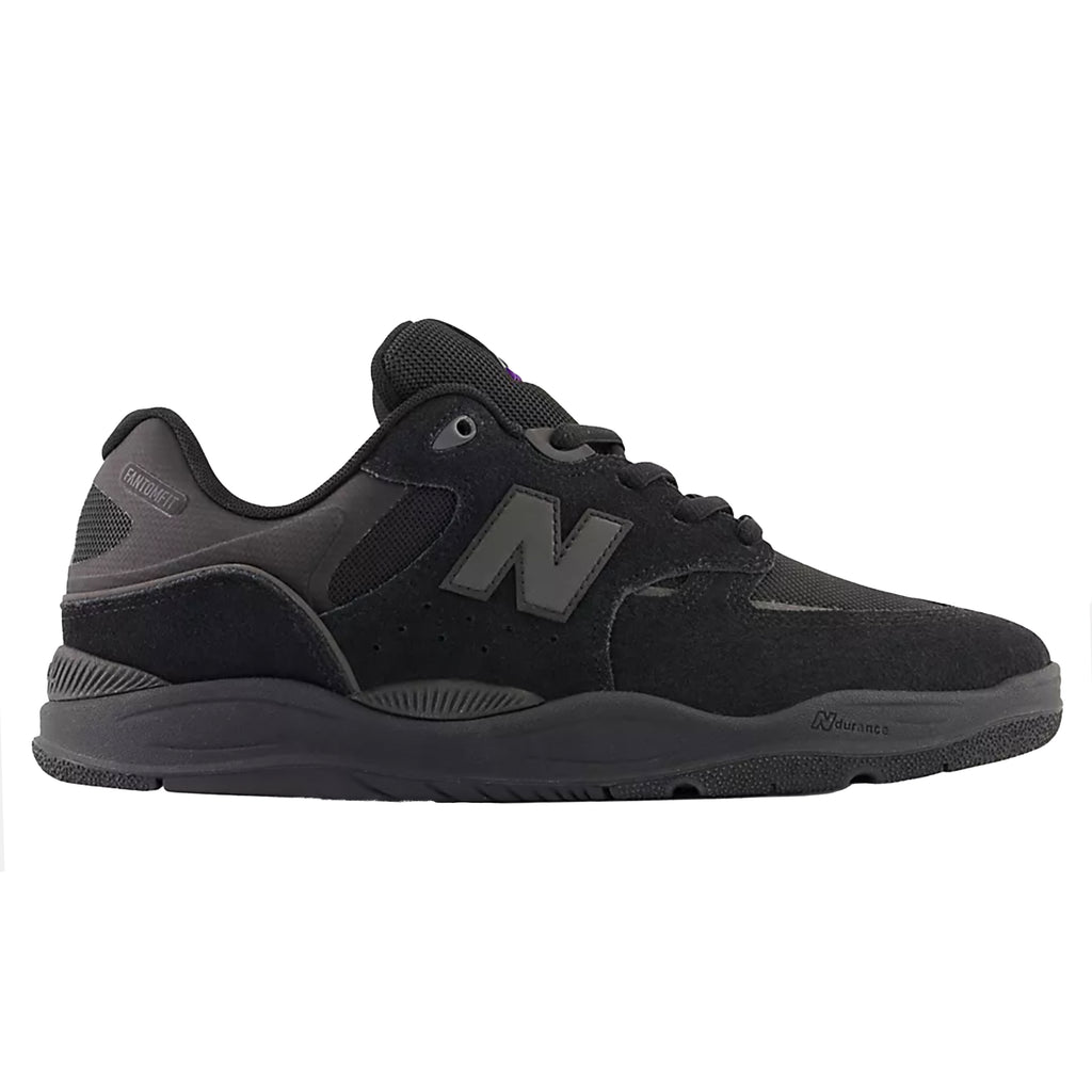 A black and grey NB Numeric 1010 Tiago shoes on a white background.