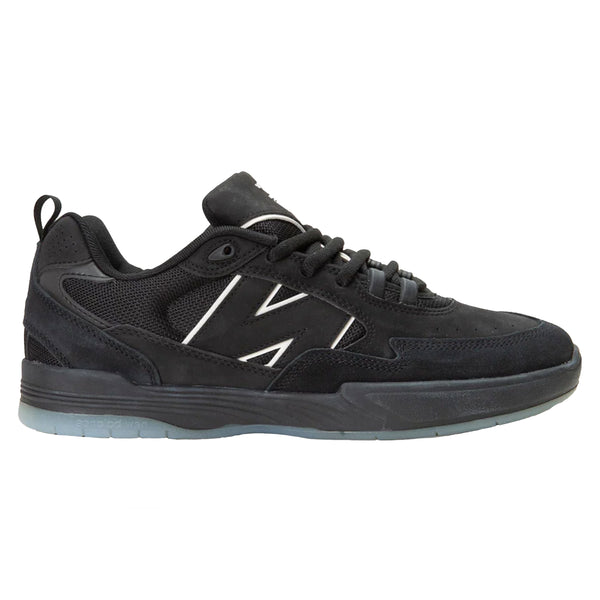 A NB Numeric 808 Tiago Black/Black/Clear shoe with white text.