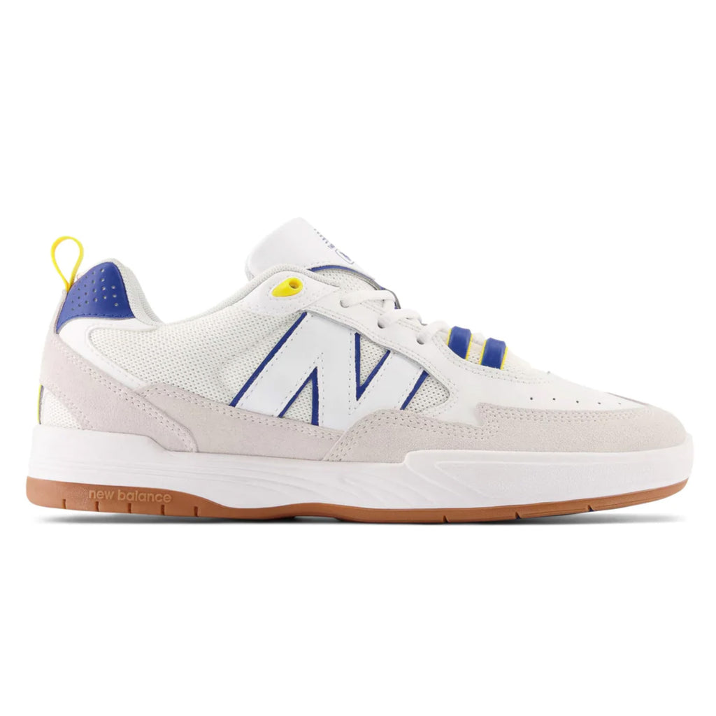 A NB NUMERIC 808 Tiago white and blue sneaker with yellow accents.