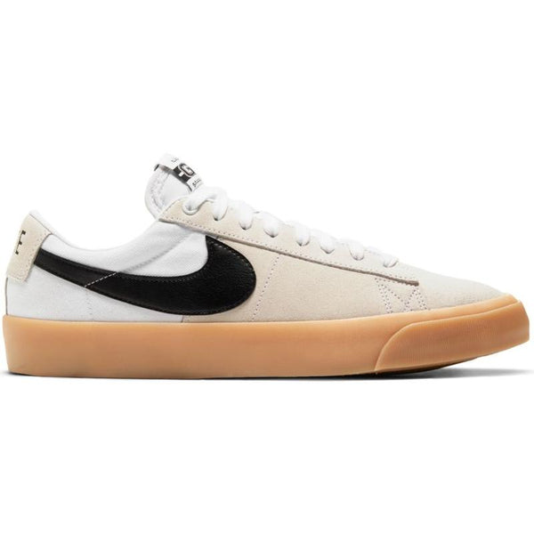 A white and black Nike SB Blazer Low Pro GT sneaker with gum soles.