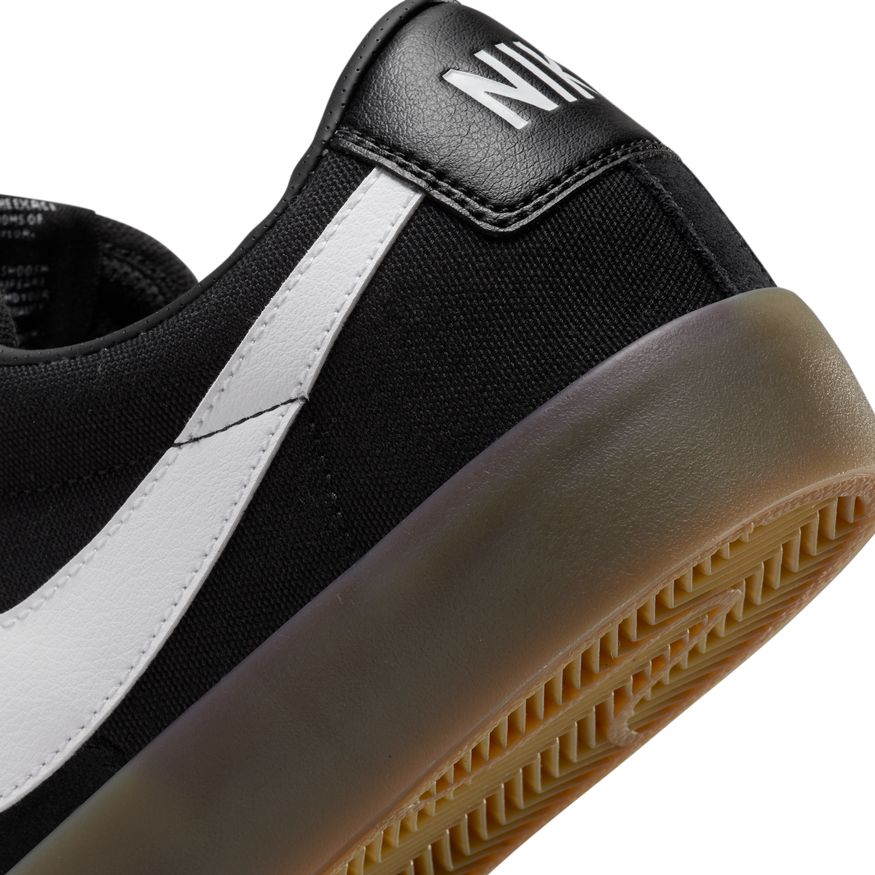 A pair of Nike SB Blazer Low Pro GT black/white/gum sneakers.