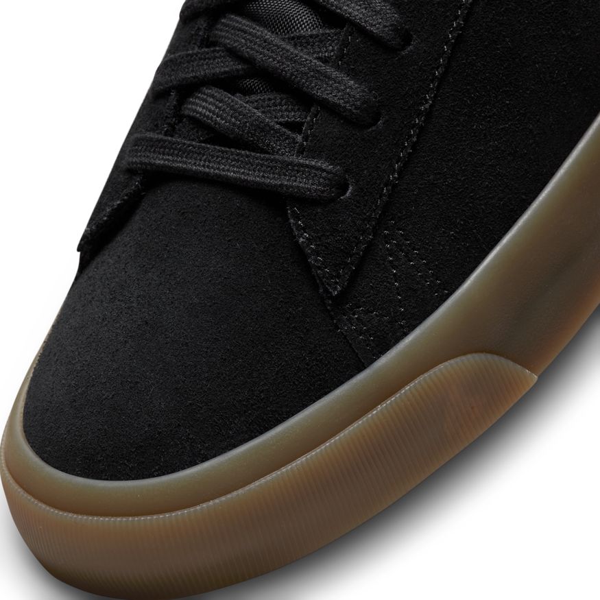 A Nike black and brown sneaker with a rubber sole would be the NIKE SB BLAZER LOW PRO GT BLACK / WHITE / GUM.