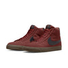 a pair of NIKE SB BLAZER MID OXEN BROWN / BLACK sneakers on a white background by nike.