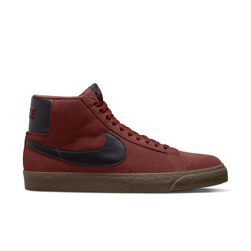 A pair of Nike SB Blazer Mid Oxen Brown/Black sneakers on a white background.