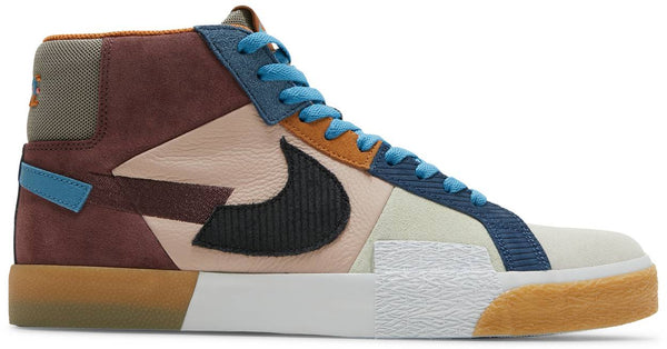 Introducing the NIKE SB BLAZER MID PREMIUM DARK WINE / BLACK / PINK OXFORD: a stylish high-top sneaker with a multicolored patchwork design featuring brown, beige, blue, and black elements, blue laces, and a gum sole. Perfect for making a statement on the streets or at Bluetile Skateboards.
