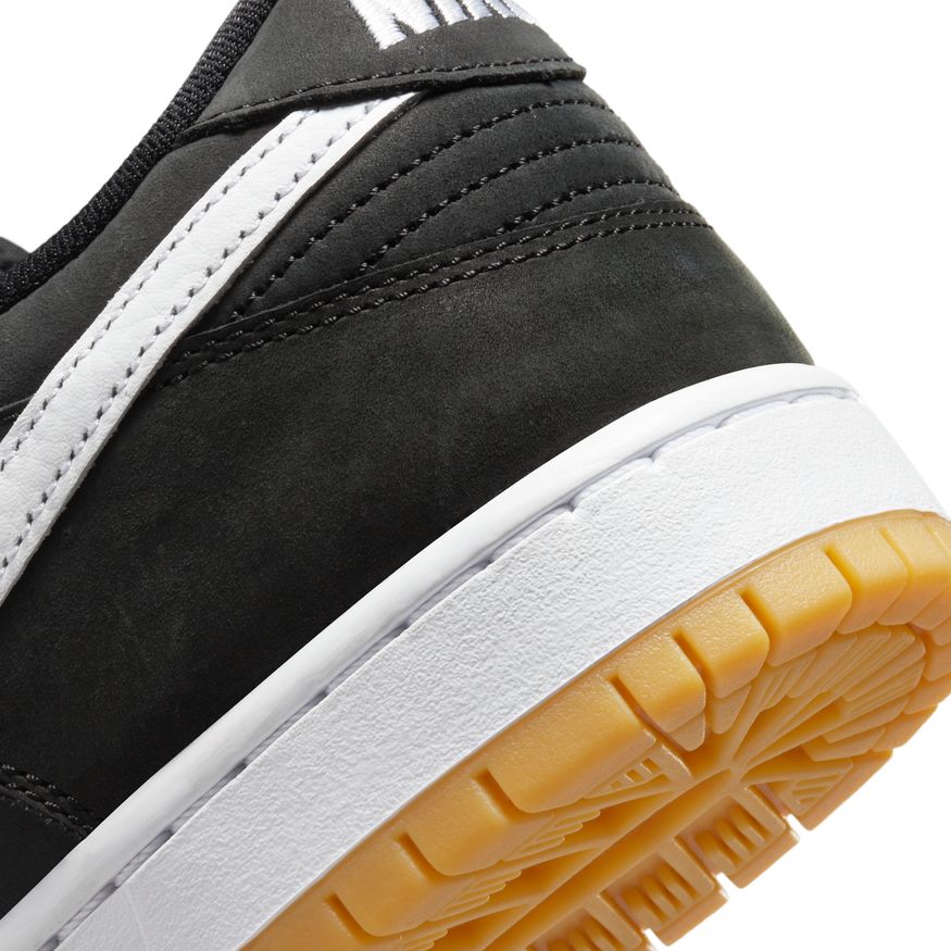 The NIKE SB DUNK LOW BLACK / WHITE / GUM is black and white.