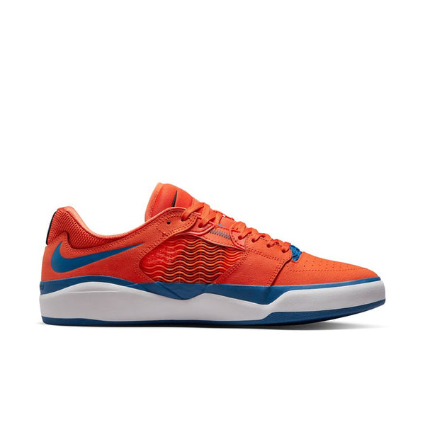 The NIKE SB ISHOD PRM ORANGE / BLUE JAY is a low-top sneaker with a white midsole, blue outsole, and wavy textured panels—available exclusively at BLUETILE SKATEBOARDS in Columbia, SC.