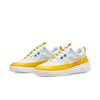 A white and yellow sneaker with yellow accents from NIKE SB NYJAH FREE II DARK SULFUR/WHITE-LASER BLUE by Nike.