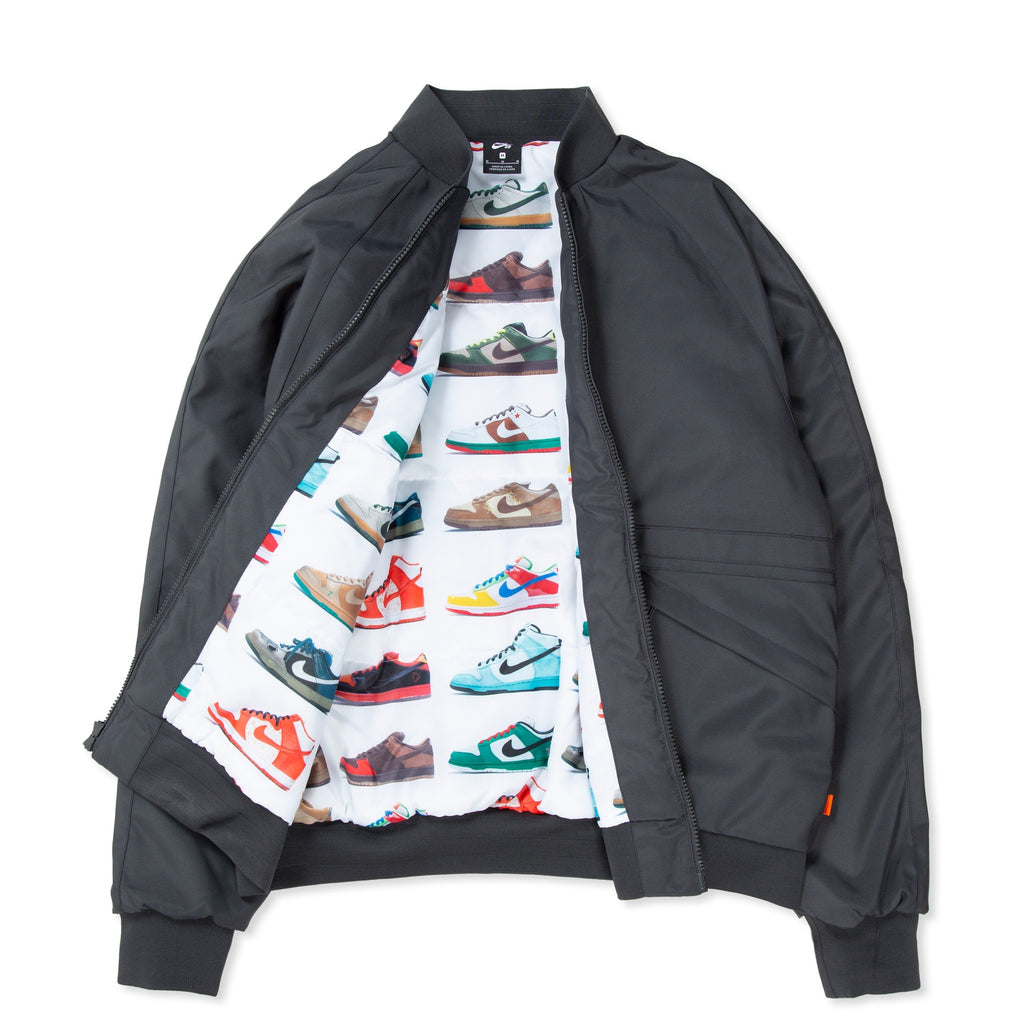 Nike swoosh bomber jacket - black. This Nike SB Orange Label Reversible Jacket from nike is a stylish and versatile addition to your wardrobe. Featuring a sleek black design with the iconic Nike swoosh, this zip